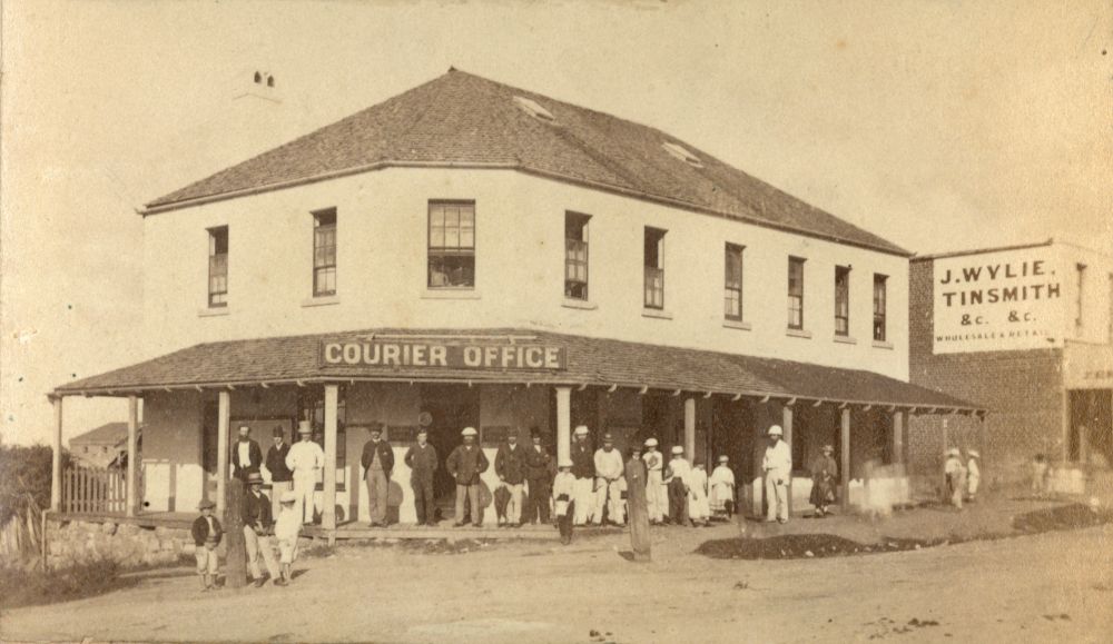 Brisbane Courier staff standing in front of the Brisbane Courier office building in Brisbane, ca. 1880
