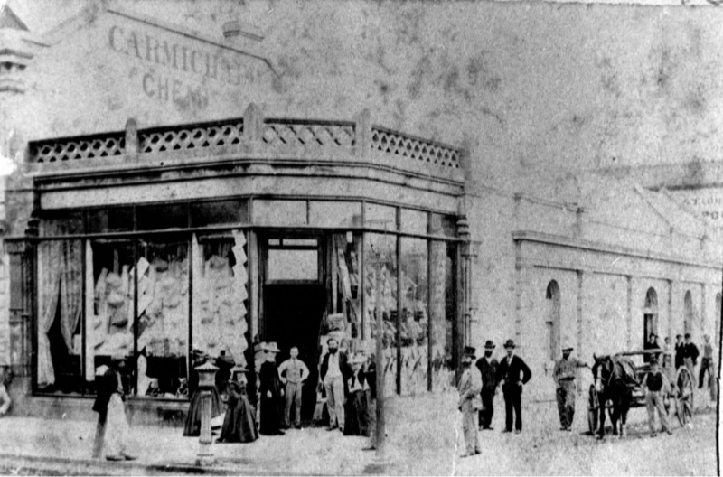 People gathered in front of Finney, Isles & Co, corner Queen and Edward Streets, Brisbane, ca. 1873