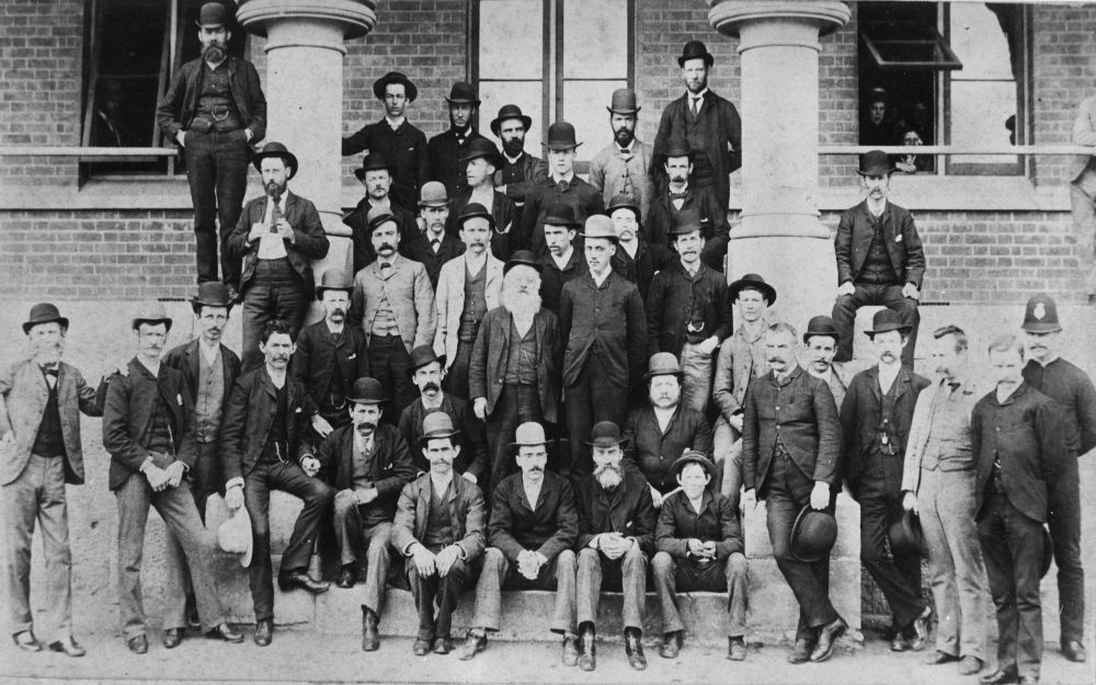 Employees on the steps of the Government Printing Office in William Street, Brisbane, ca. 1895
