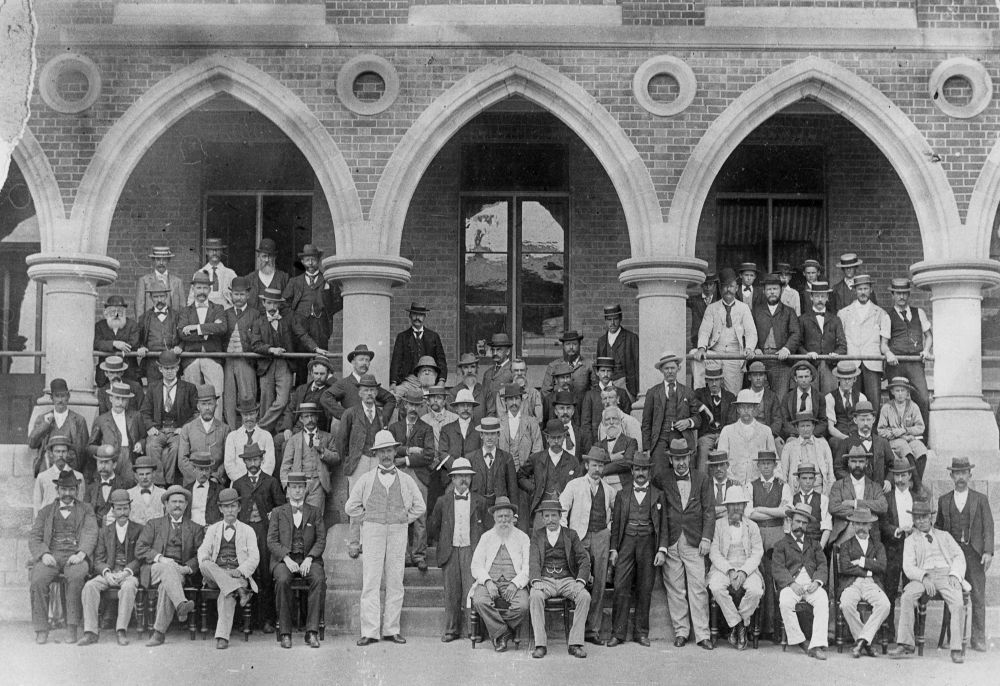 Staff gathered outside the Government Printing Office in Brisbane, ca. 1900