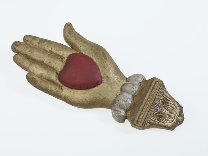Wooden hand with heart